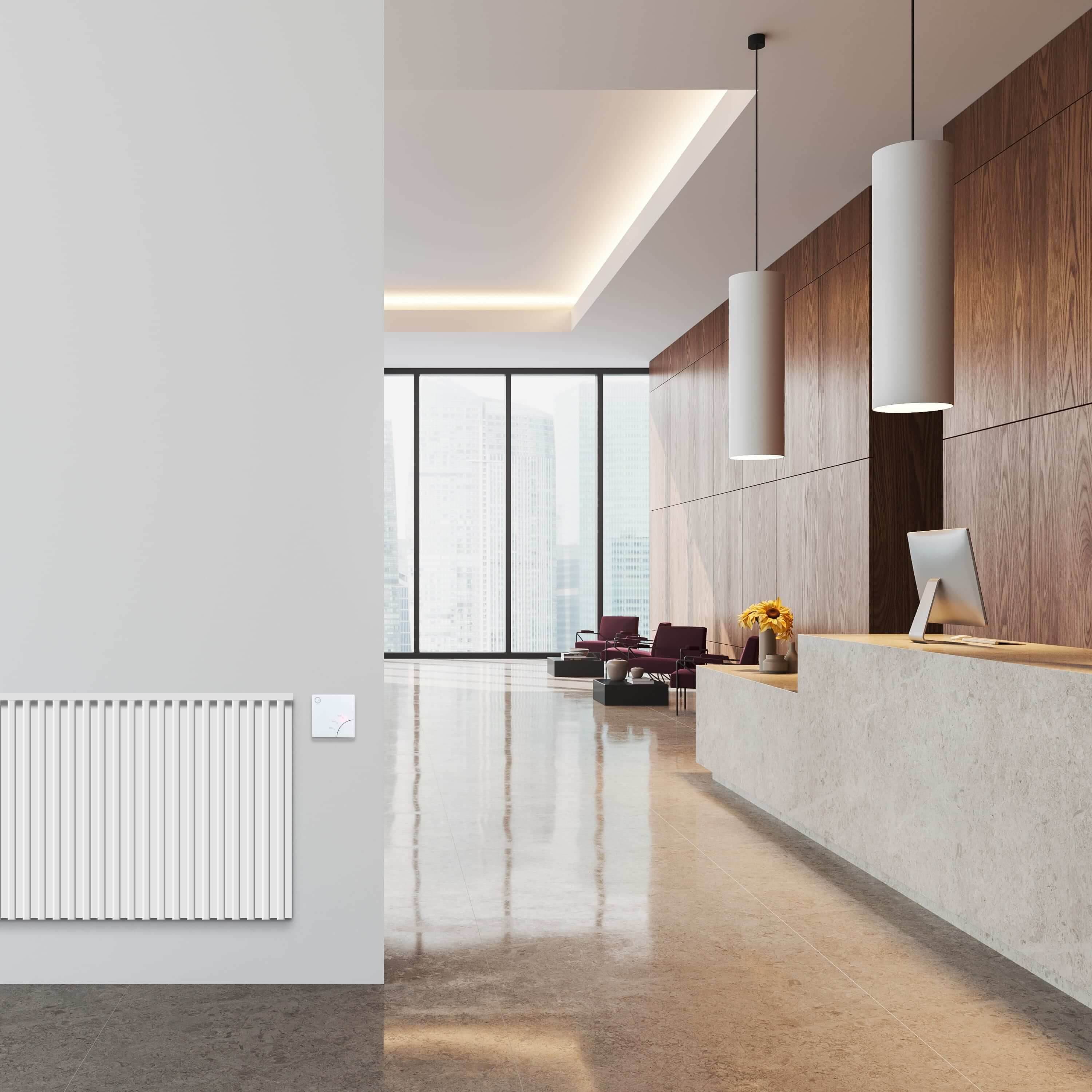 A photo of a hotel lobby with an electric heater and Electric Switch mounted on the wall